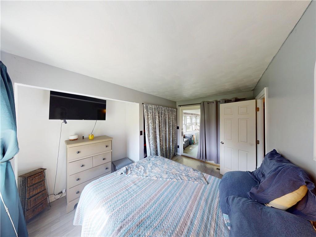 225 Fairway Lane Butler, PA 16002 - Photo 31 of 43 a bedroom with a bed and wooden floor
