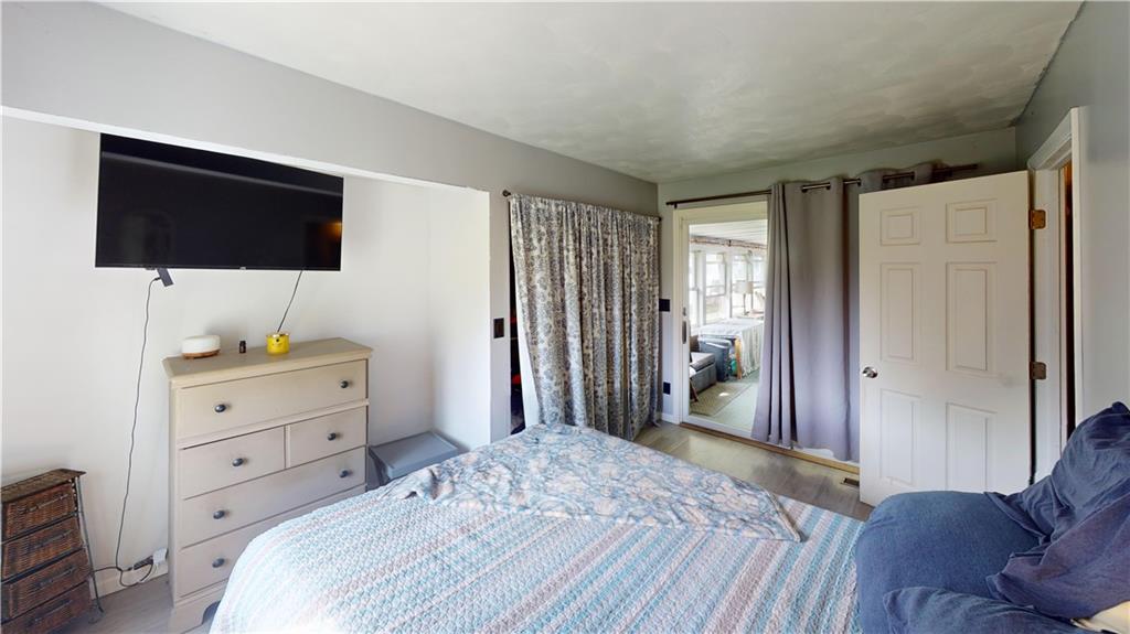 225 Fairway Lane Butler, PA 16002 - Photo 32 of 43 a bedroom with a bed and a flat screen tv