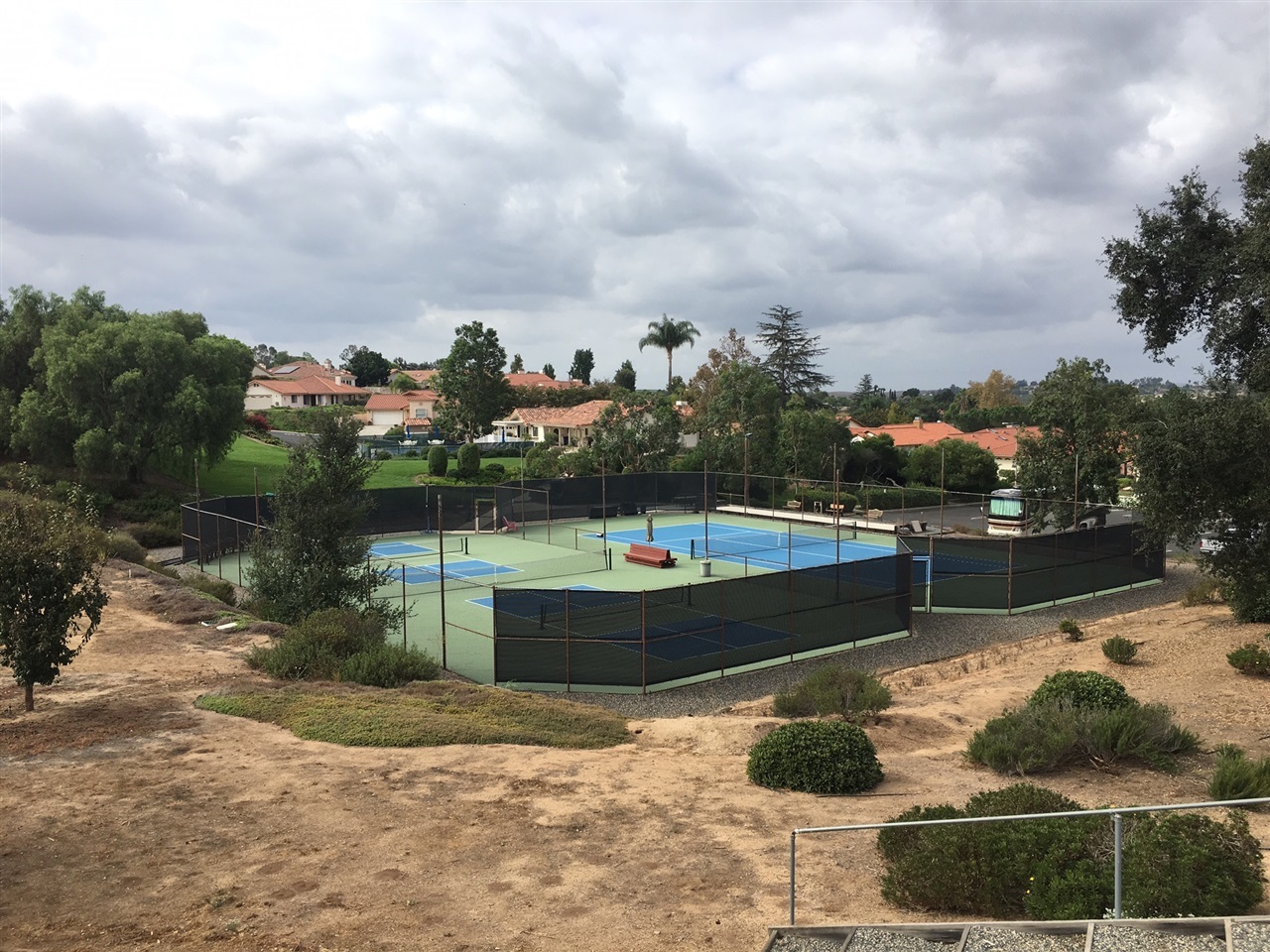 935 Crescent Bend Fallbrook, CA 92028 - Photo 10 of 25 Courts for Tennis & Pickle Ball overlook the community Center & pool area. Community Pool is heated.