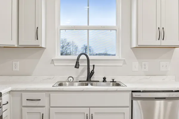 a close view of a sink and a window