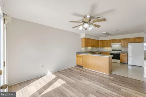 a view of kitchen with wooden floor