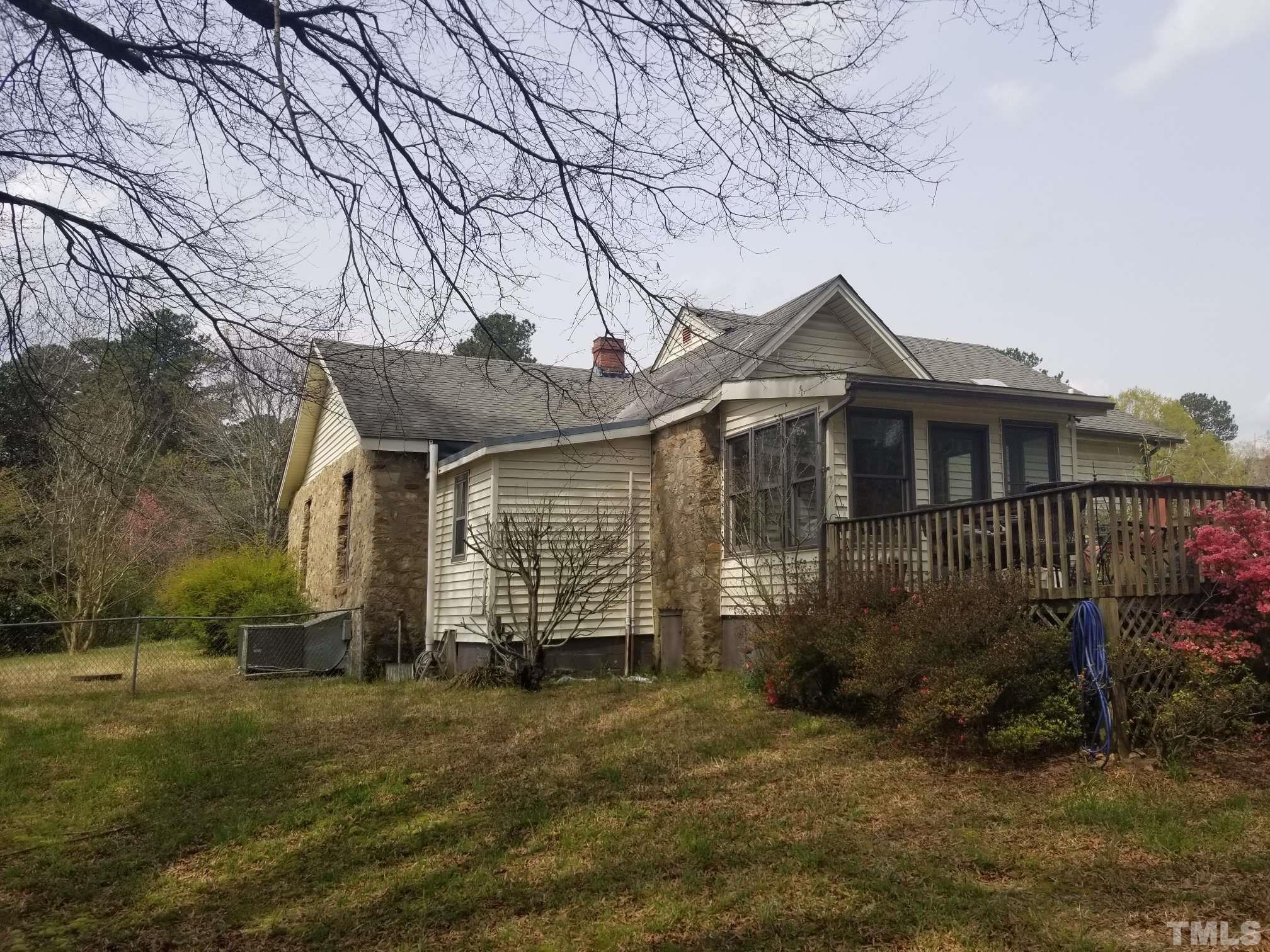5215 Old Stage Road Raleigh, NC 27603 - Photo 1 of 12 a front view of a house with garden