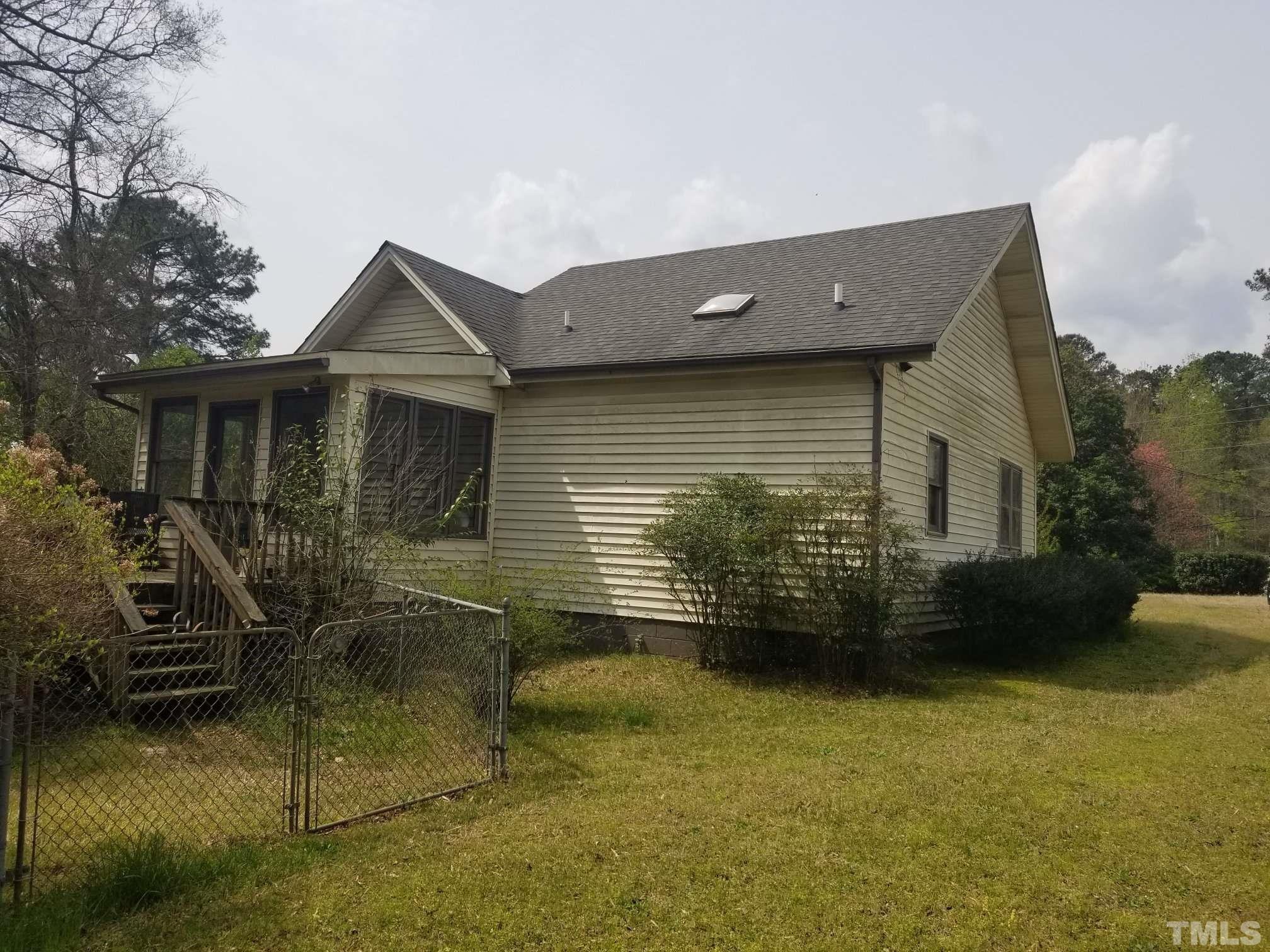 5215 Old Stage Road Raleigh, NC 27603 - Photo 2 of 12 a view of a house with backyard