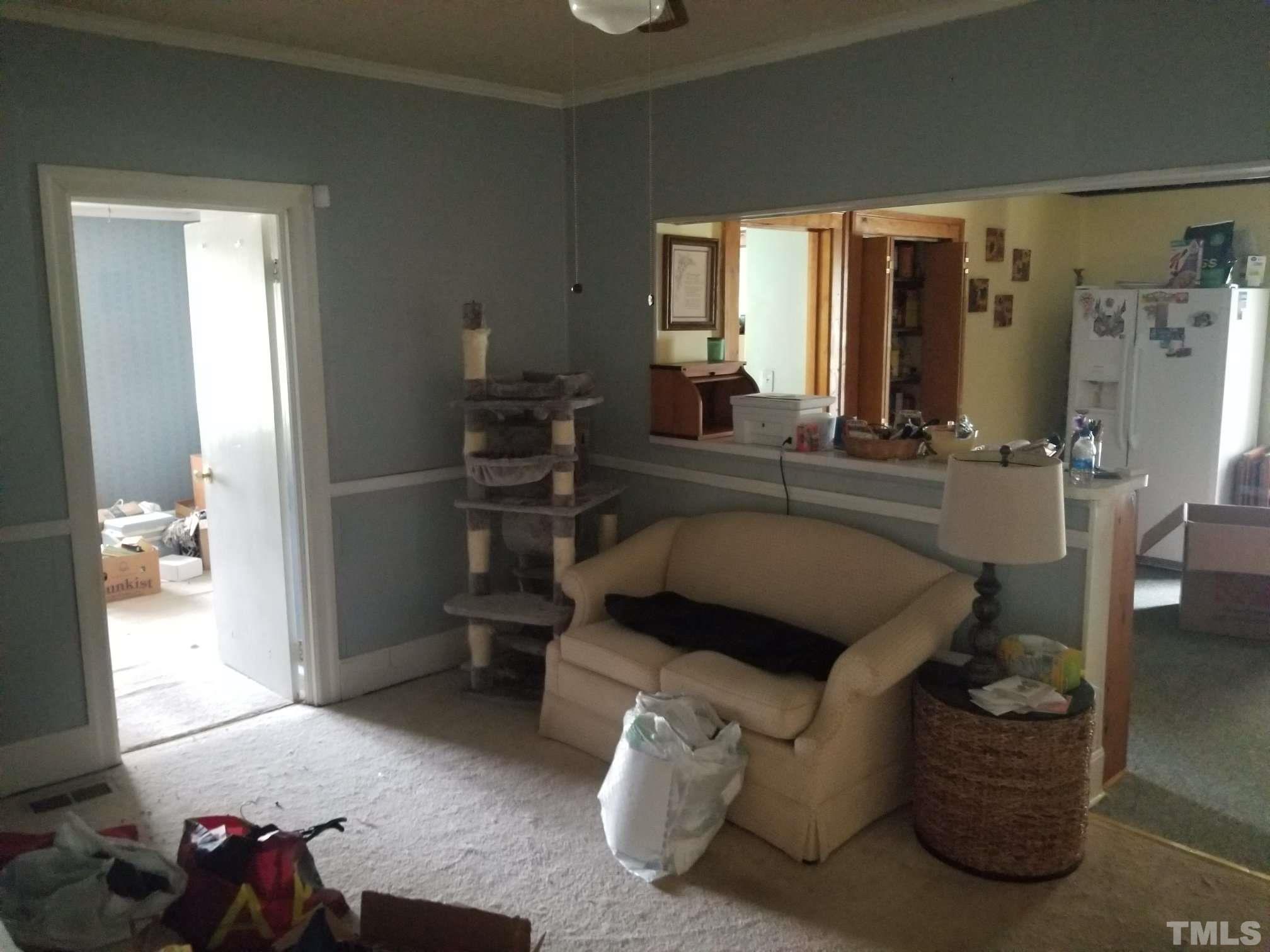 5215 Old Stage Road Raleigh, NC 27603 - Photo 5 of 12 a living room with furniture and a gate