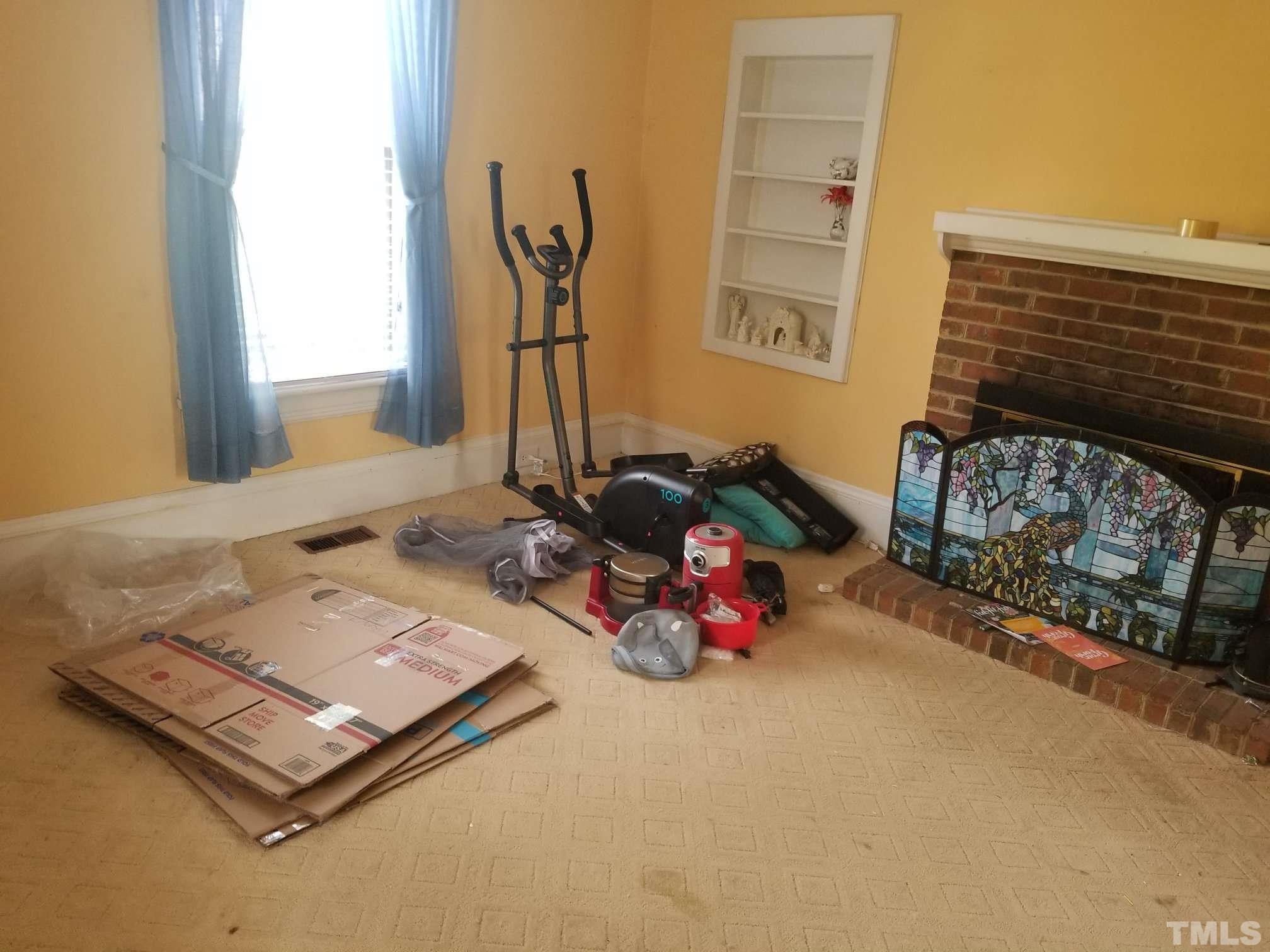 5215 Old Stage Road Raleigh, NC 27603 - Photo 6 of 12 a room with furniture and a window