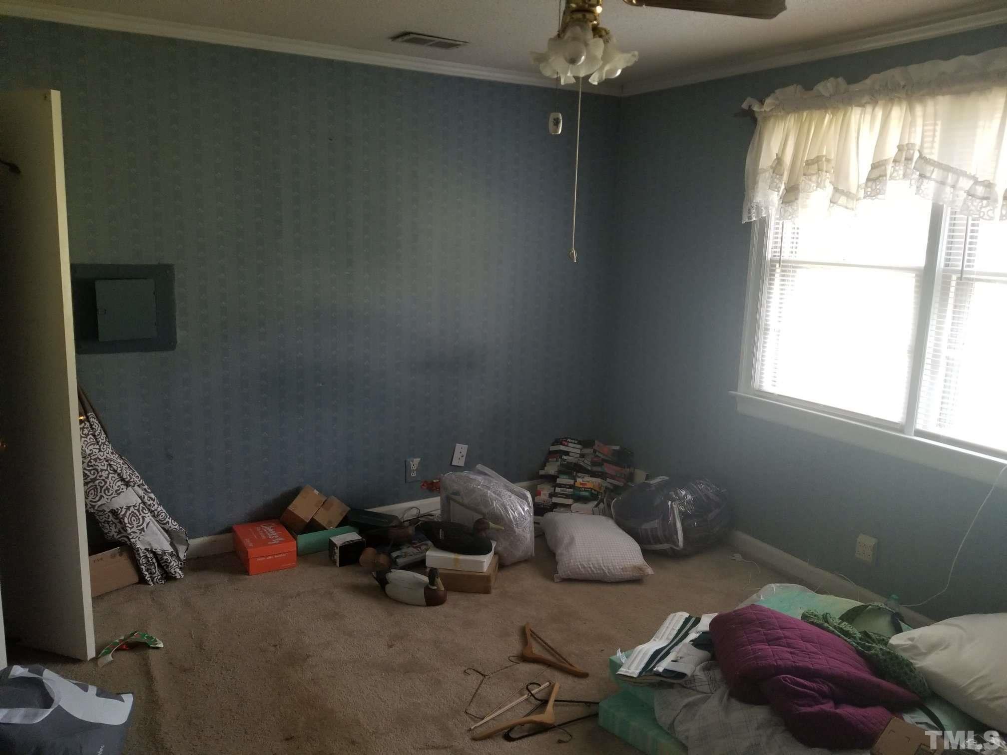 5215 Old Stage Road Raleigh, NC 27603 - Photo 9 of 12 a room with toys and a window