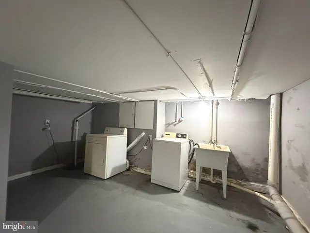 a living room with a table and chairs