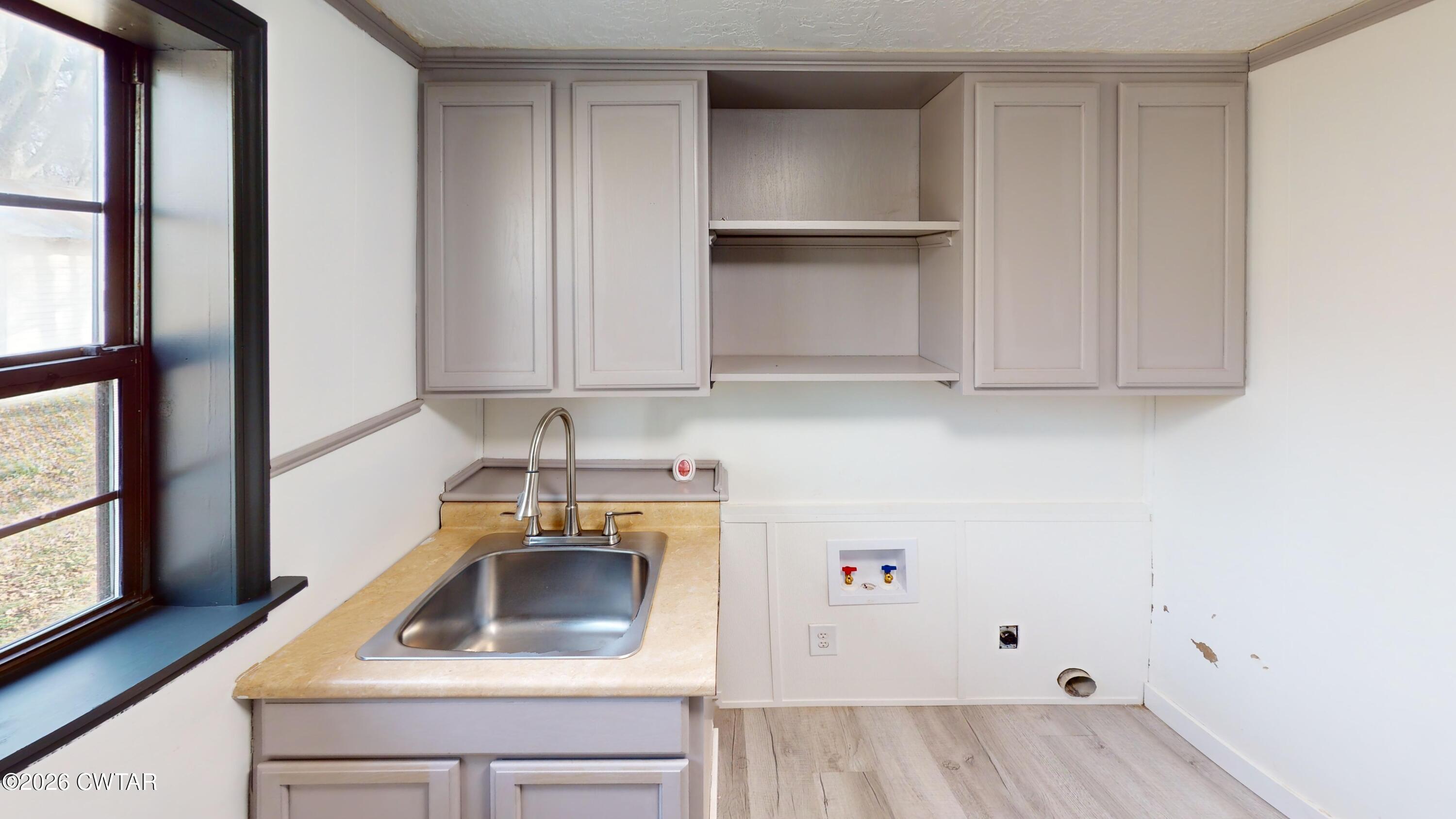 48 Miston Tank Road Ridgely, TN 38080 - Photo 11 of 18 a kitchen with a sink and cabinets
