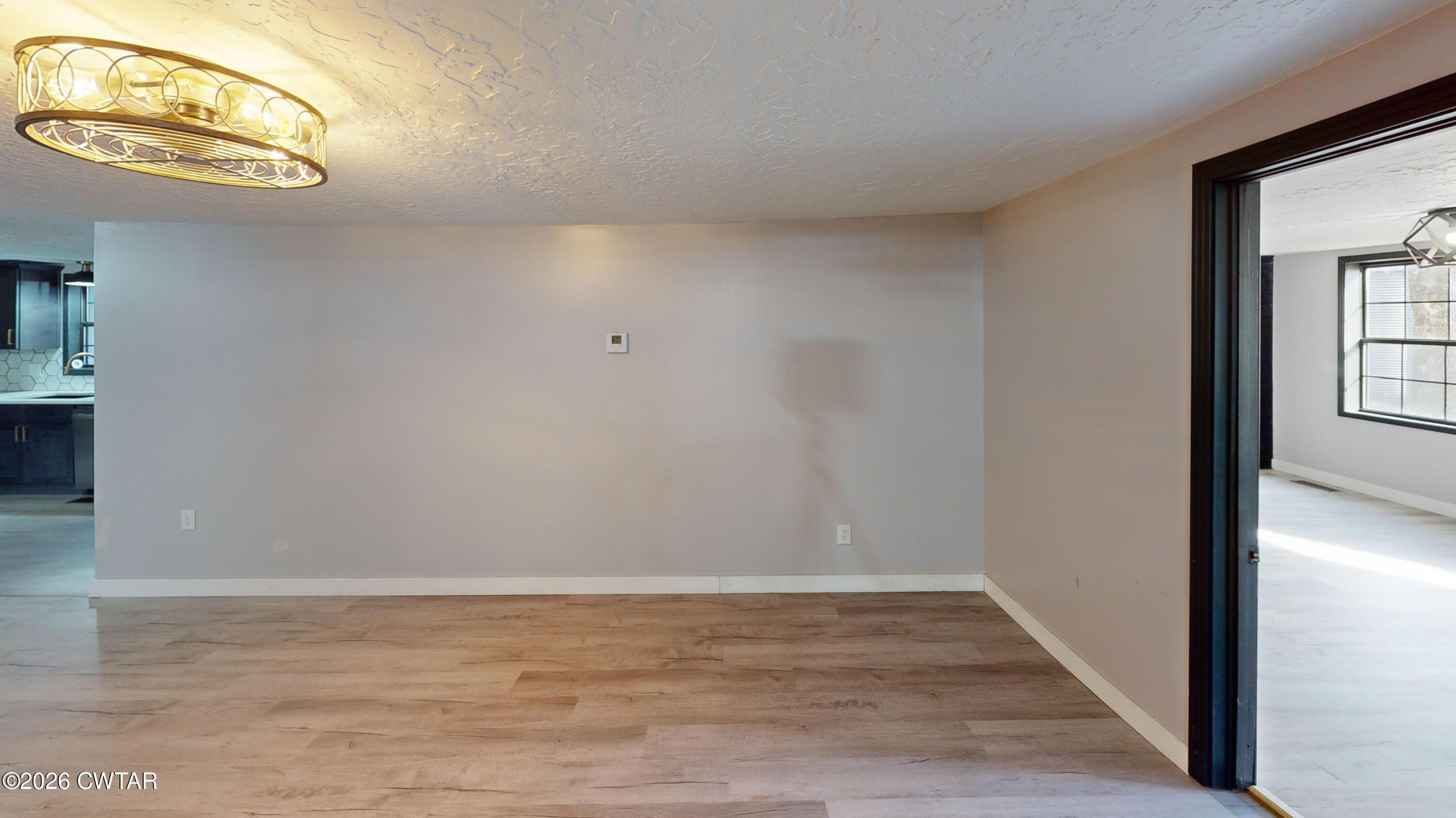 48 Miston Tank Road Ridgely, TN 38080 - Photo 13 of 18 a view of a room with wooden floor and a window