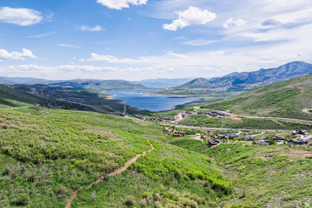 140 West Vista Road Kamas, UT 84036 - Photo 100 of 101 Expansive mountain landscape featuring a large body of water, green hillsides, and distant residences