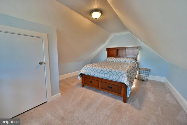 a room with a bed and lamp