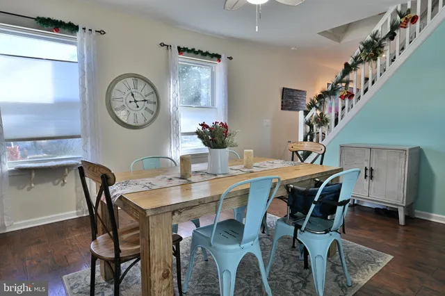 a view of a dining room with furniture and wooden floor