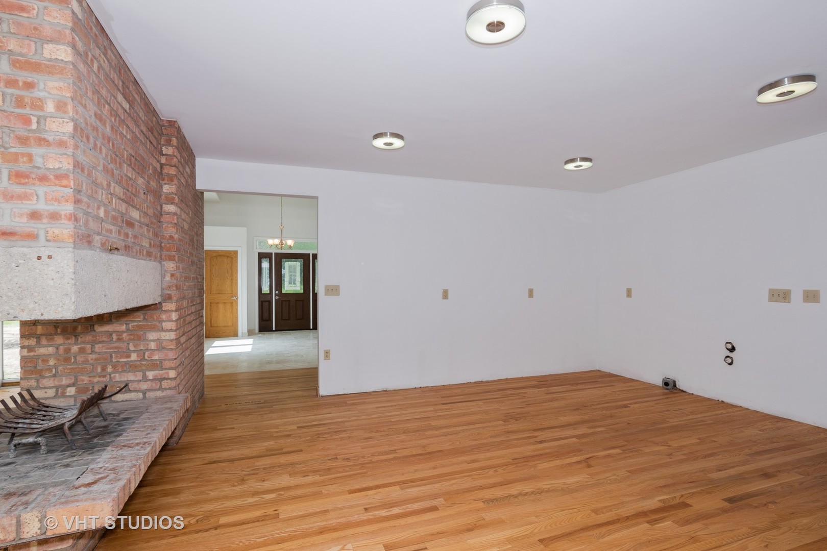 34W101 Army Trail Road Wayne, IL 60184 - Photo 5 of 20 a view of empty room with wooden floor and fan