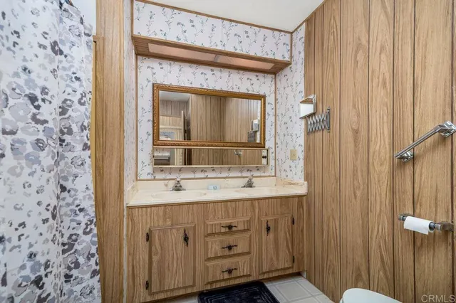 a bedroom with a bed and a view of bathroom