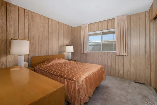 a bathroom with a sink a mirror and a shower