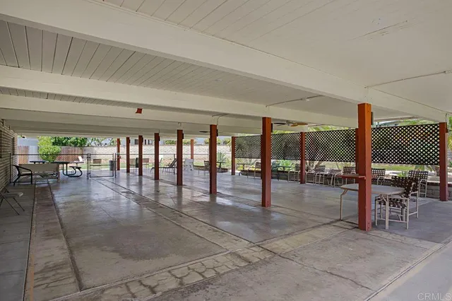 a work room with furniture and a book shelf