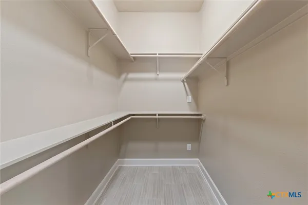 a view of a room with racks on the wall