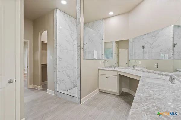 a bathroom with a double vanity sink mirror and double