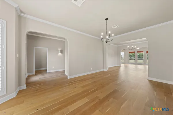 a view of a livingroom with wooden floor