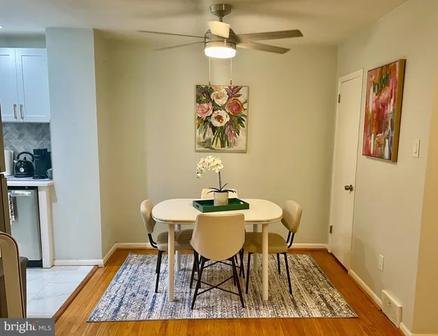a view of a dining room with furniture and wooden floor