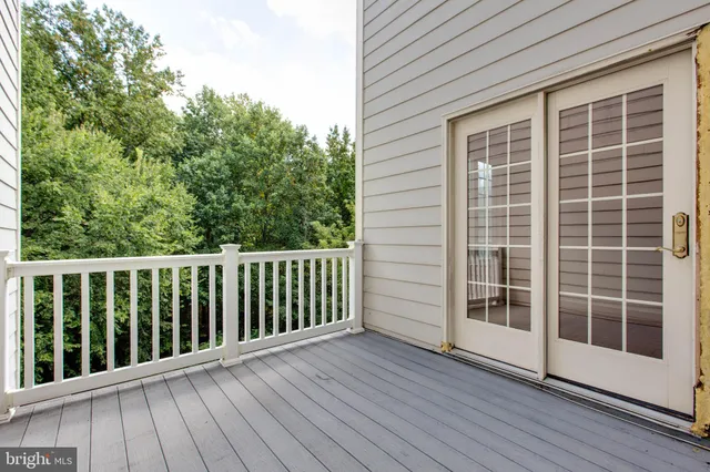 a view of a house with a door and wooden floor