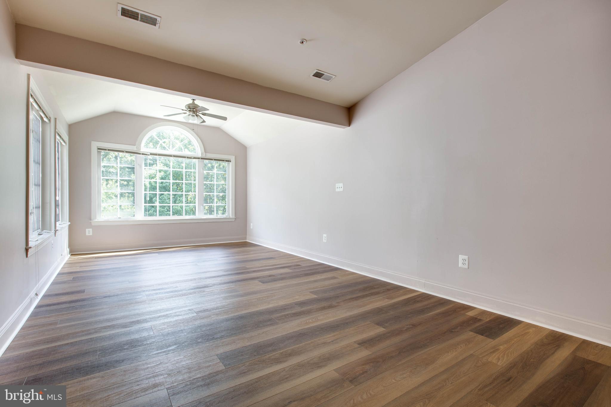 2119 Split Creek Lane Hanover, MD 21076 - Photo 23 of 55 wooden floor in an empty room with a window
