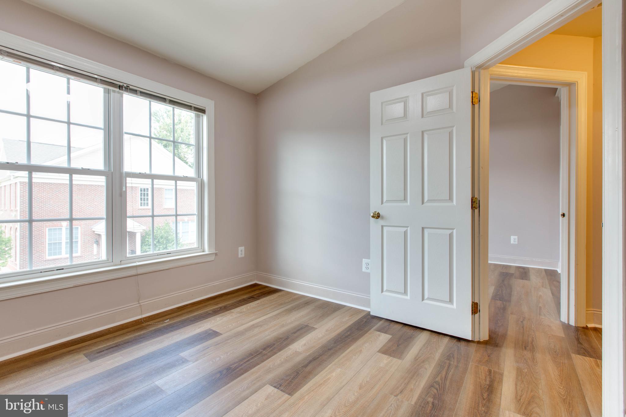 2119 Split Creek Lane Hanover, MD 21076 - Photo 29 of 55 an empty room with wooden floor and windows