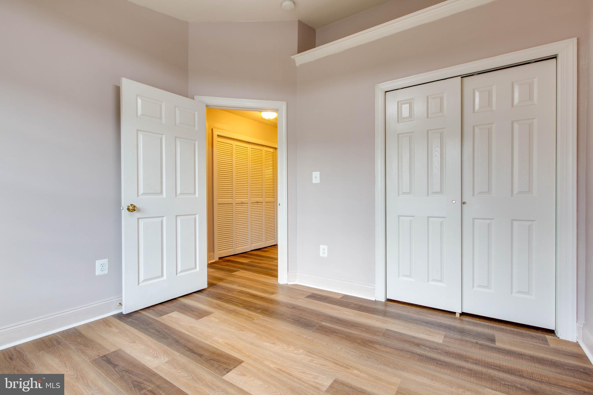 2119 Split Creek Lane Hanover, MD 21076 - Photo 30 of 55 a view of an empty room with wooden floor