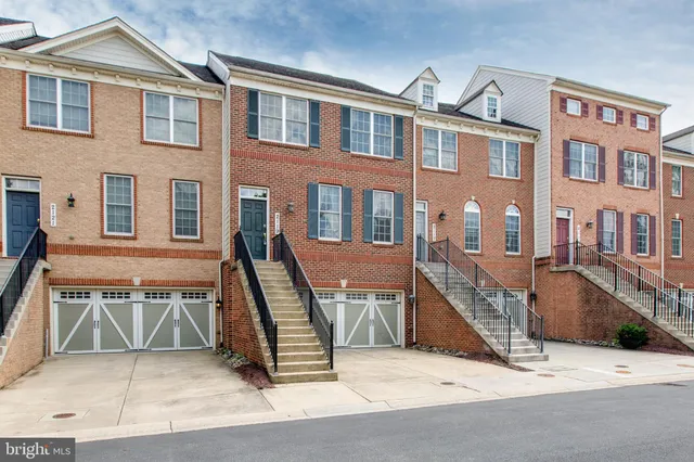 a view of a brick house with many windows