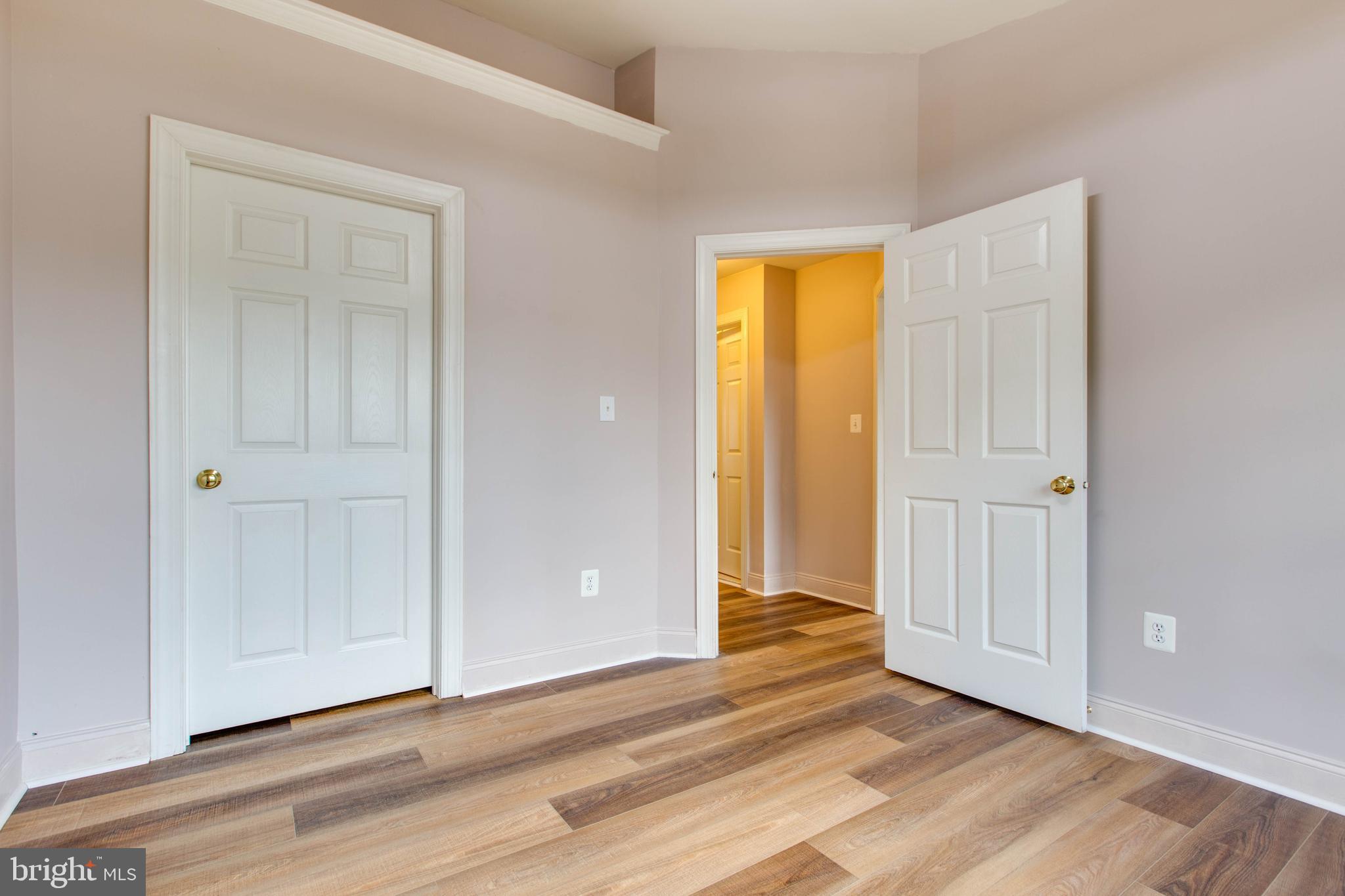 2119 Split Creek Lane Hanover, MD 21076 - Photo 34 of 55 a view of an empty room with wooden floor and closet