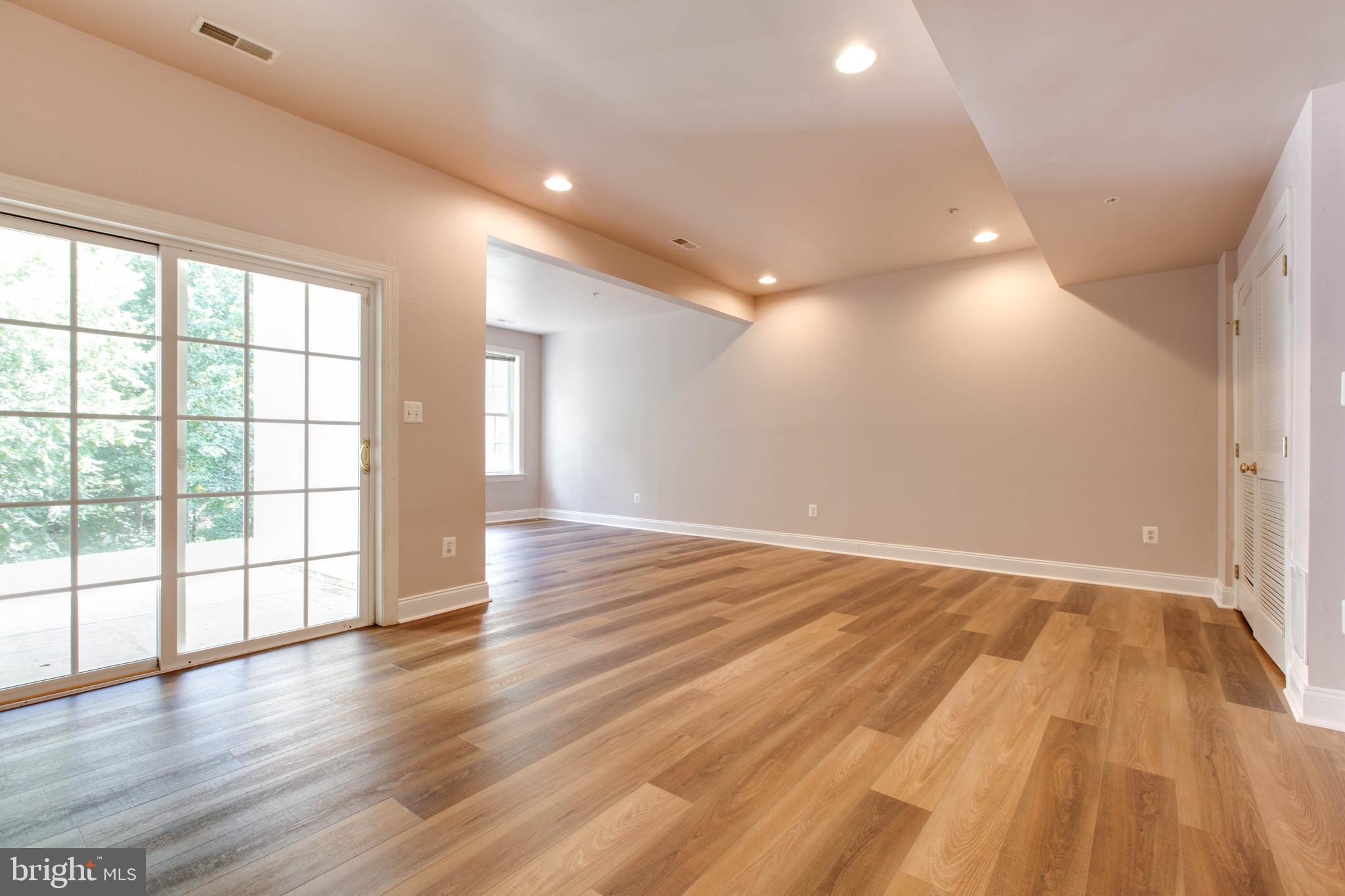 2119 Split Creek Lane Hanover, MD 21076 - Photo 38 of 55 a view of an empty room with wooden floor and a window