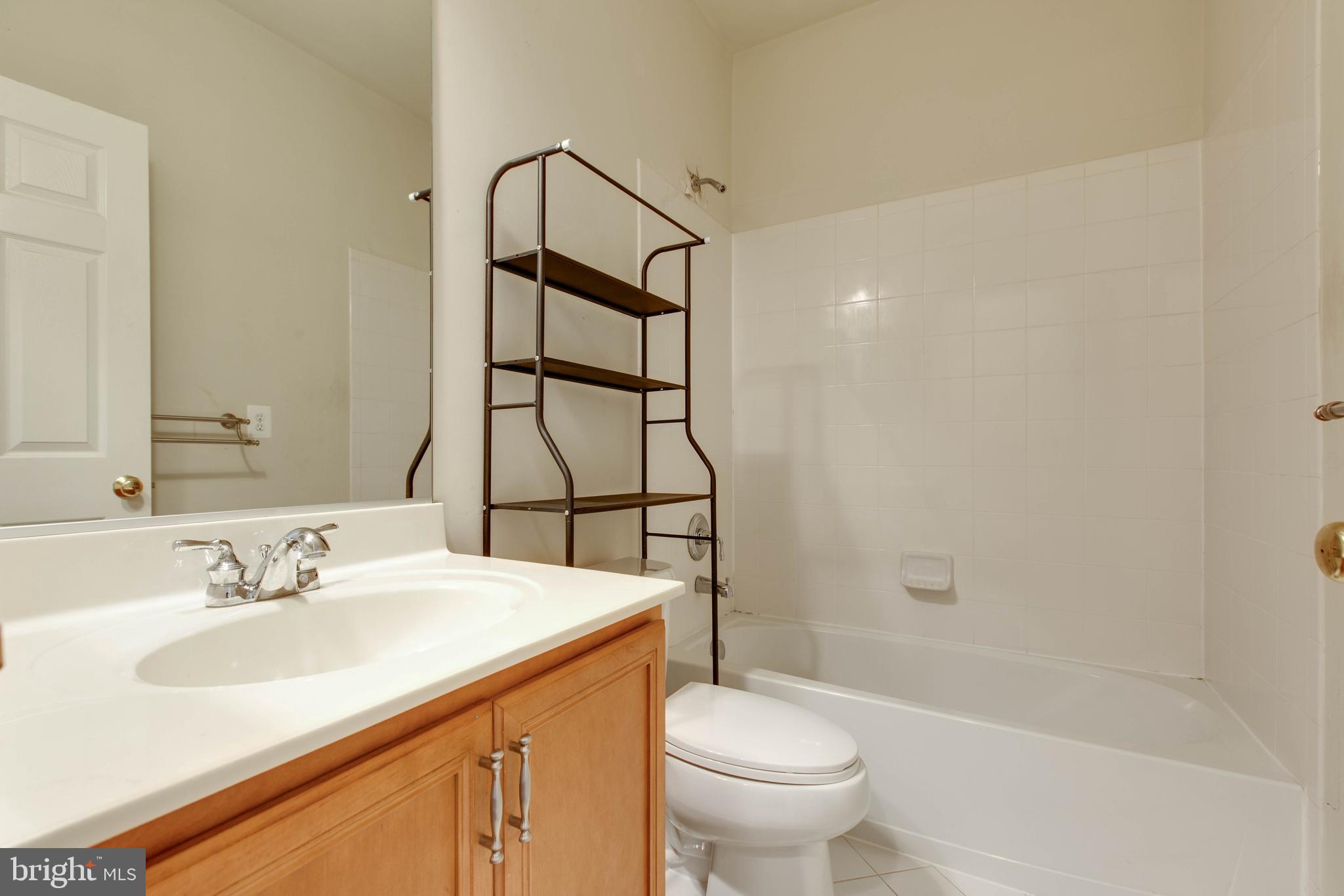 2119 Split Creek Lane Hanover, MD 21076 - Photo 41 of 55 a bathroom with a sink toilet and shower