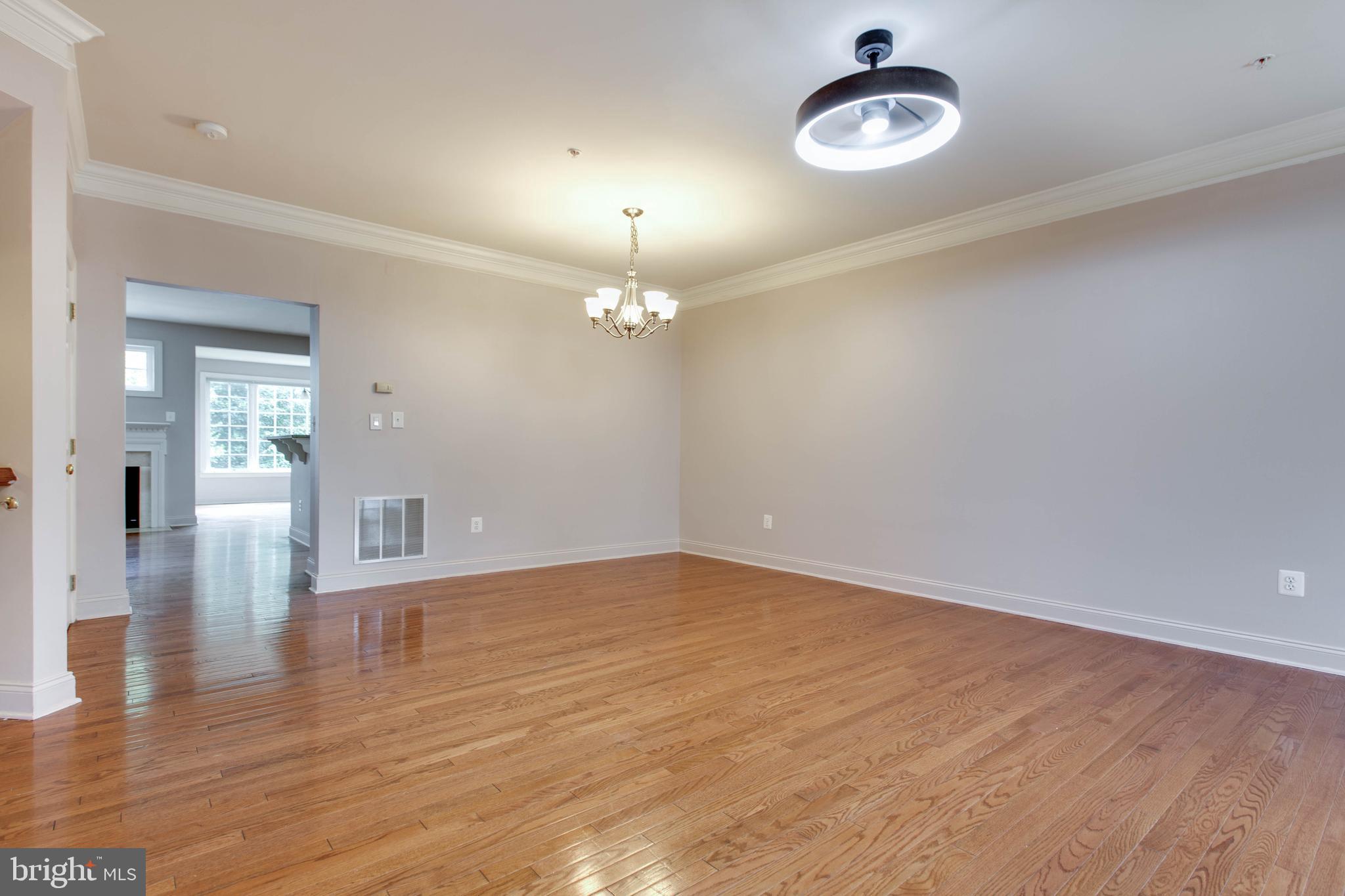 2119 Split Creek Lane Hanover, MD 21076 - Photo 8 of 55 wooden floor in an empty room with a window