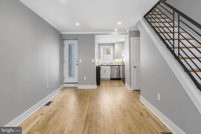 a view of livingroom with furniture wooden floor and staircase