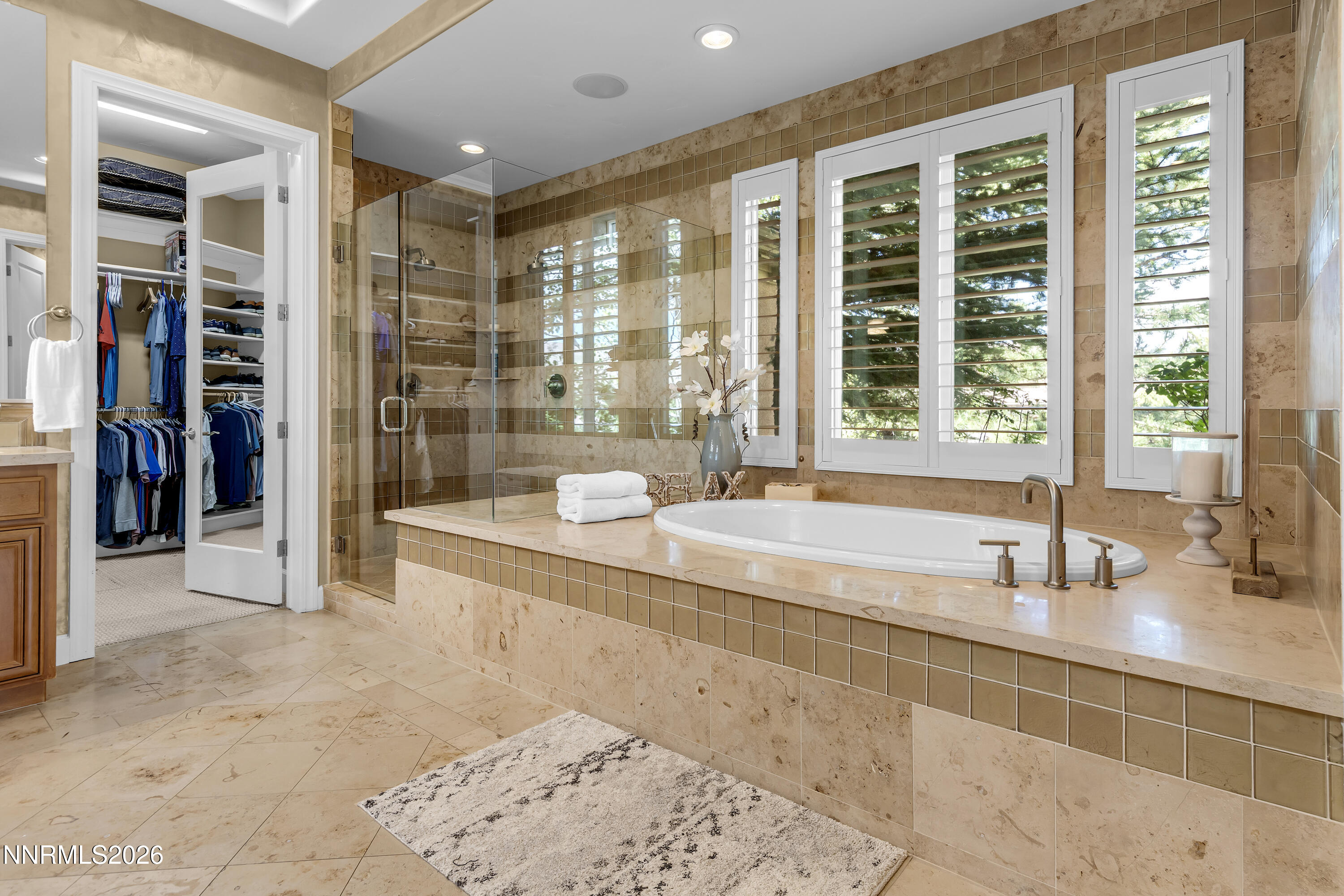 1898 Laurel Ridge Drive Reno, NV 89523 - Photo 10 of 87 a bathroom with a tub and a sink next to a window