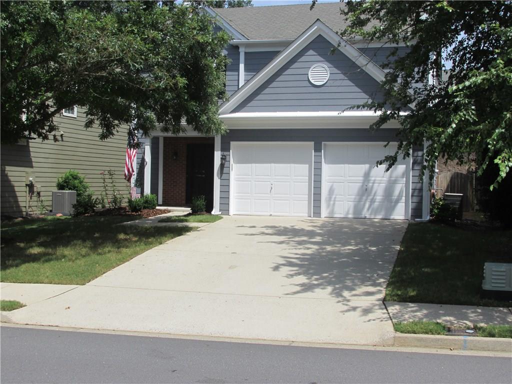 4130 Ridgefair Drive Cumming, GA 30040 - Photo 1 of 1 a view of a white house with a large tree