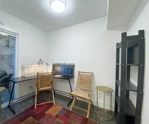 a workspace with furniture and a window