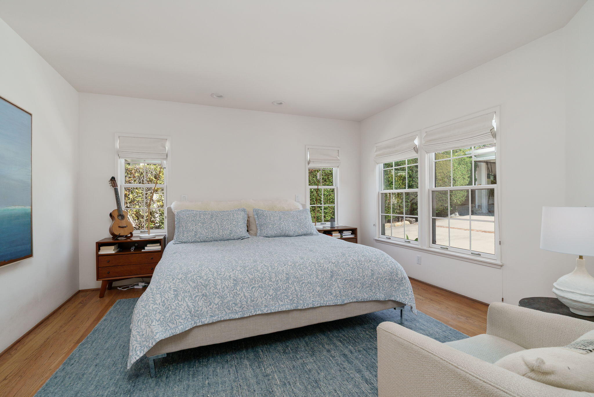 2228 Chapala Street Santa Barbara, CA 93105 - Photo 14 of 31 a bedroom with a bed and wooden floor