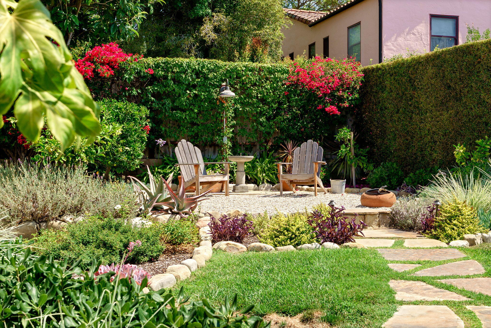 2228 Chapala Street Santa Barbara, CA 93105 - Photo 25 of 31 a view of a chair and table in the garden front of house