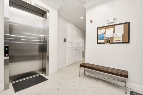a hallway with sliding door and wooden floor