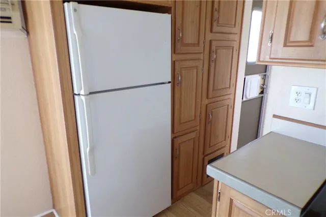 a view of a kitchen from the hallway