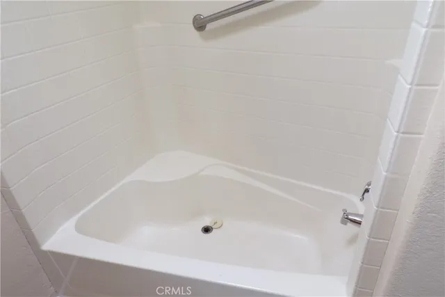 a close view of a bathtub in bathroom
