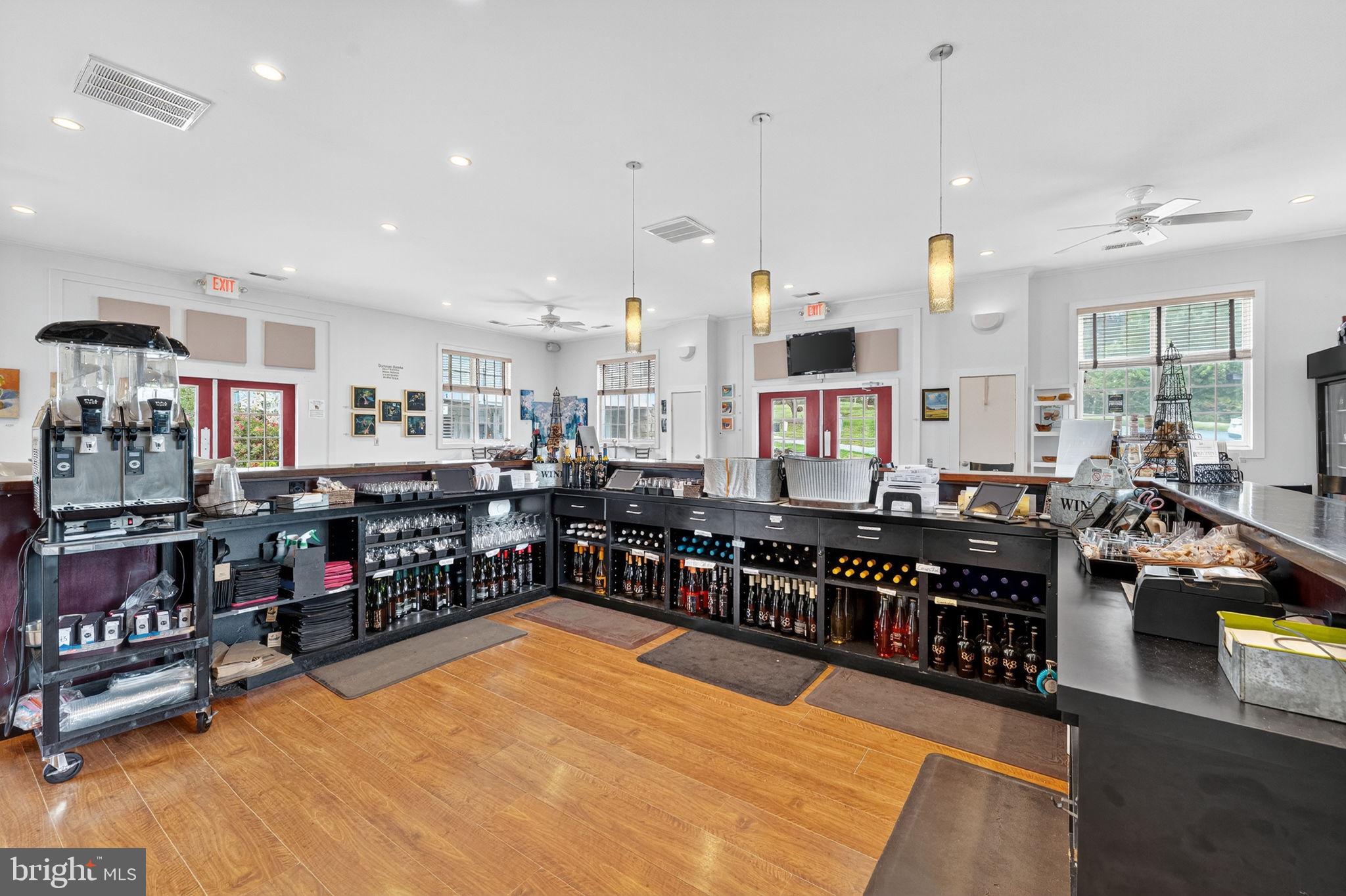 14001 Harpers Ferry Road Purcellville, VA 20132 - Photo 36 of 70 Behind the bar in the tasting room