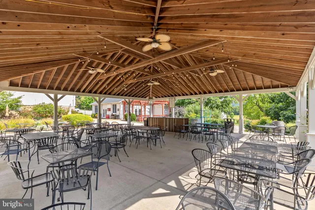 a kitchen with stainless steel appliances granite countertop a refrigerator a oven and a sink