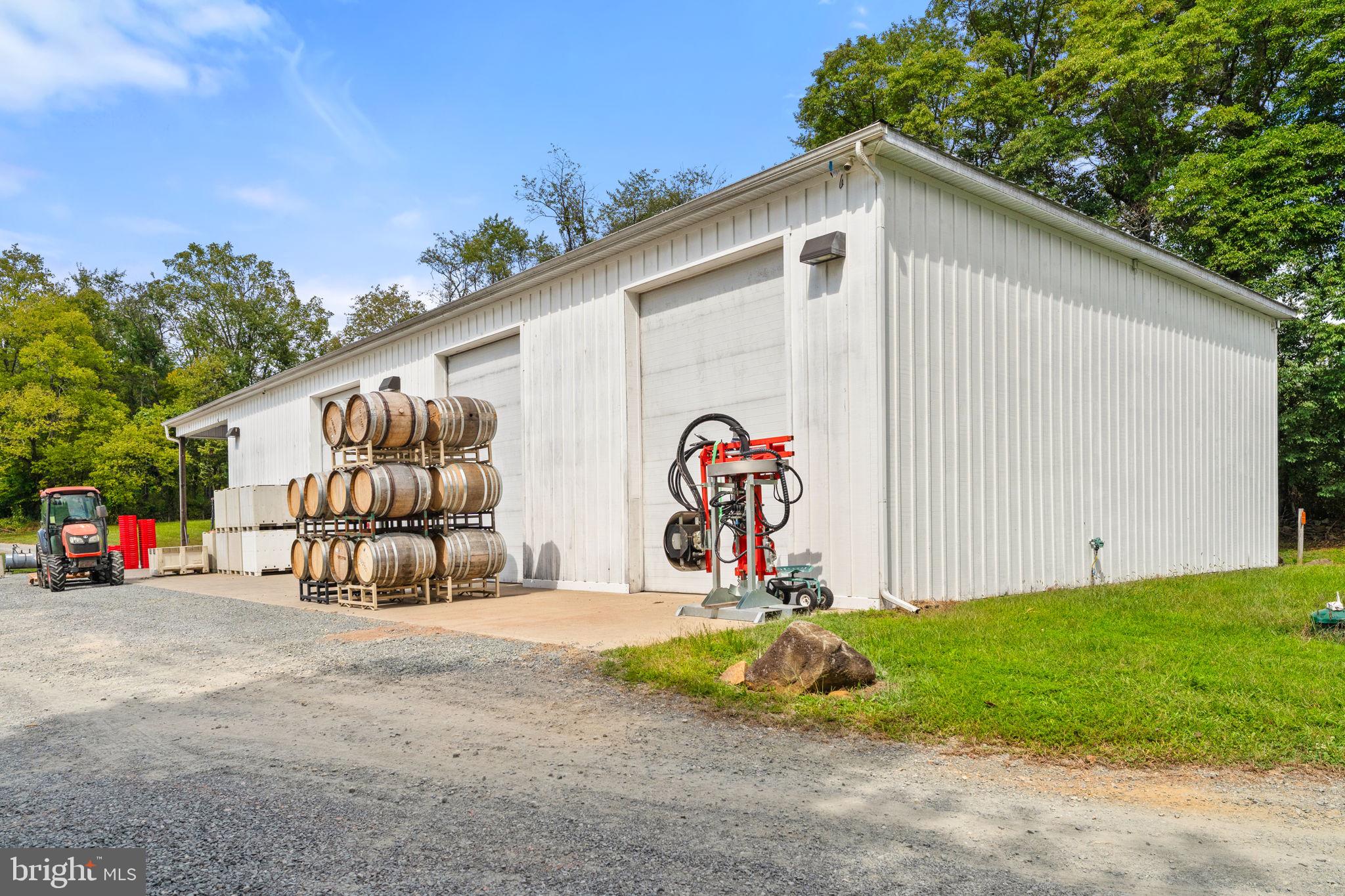 14001 Harpers Ferry Road Purcellville, VA 20132 - Photo 66 of 70 Winery with three high lift doors