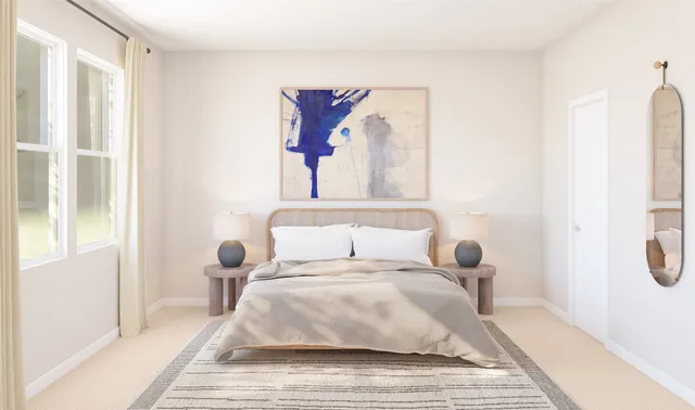 a bedroom with a bed and a couch