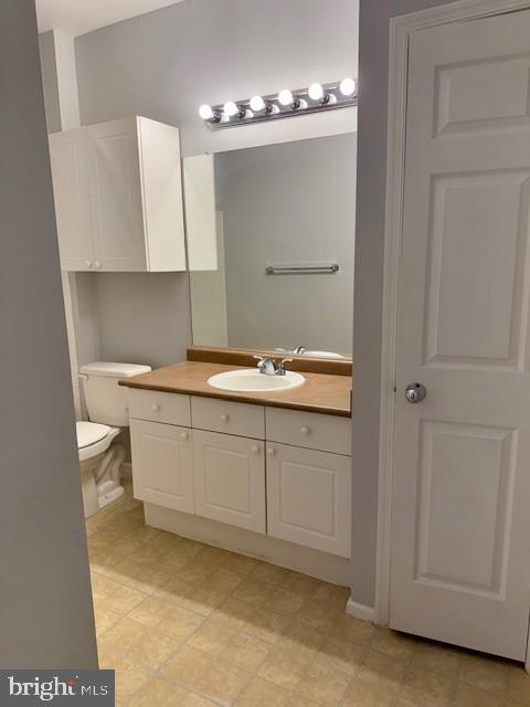 11800 Old Georgetown Road, Unit 1104 North Bethesda, MD 20852 - Photo 12 of 17 a bathroom with a sink vanity and mirror