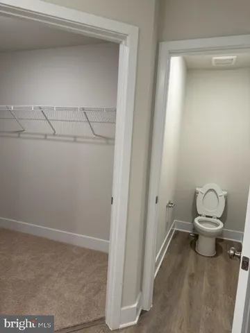 a bathroom with a toilet and a vanity