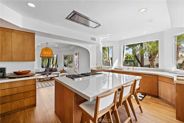 a kitchen with stainless steel appliances a stove a sink and a refrigerator