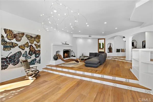 a view of a dining room with furniture wooden floor and chandelier